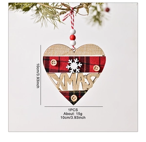 Detail of wooden heart ornament with red plaid, burlap texture, and XMAS lettering