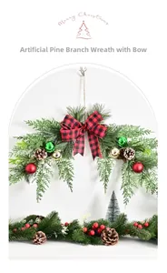 Christmas wreath detail with buffalo plaid bow, pine cones and festive berries