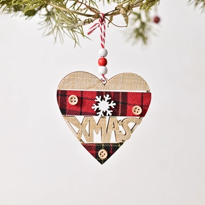 Christmas heart shaped wooden ornament with red plaid fabric and XMAS cutout on pine tree