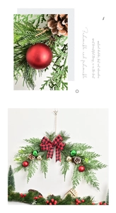 Detail of Christmas wreath with pine cones, plaid bow, and colorful ornaments on white wall