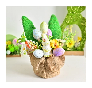 Close-up of Easter artificial potted plant with bunny ears, eggs, and burlap base