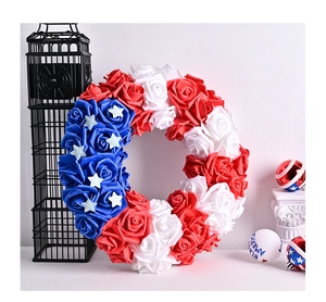 Close-up of red, white, and blue rose wreath with white stars for USA Independence Day