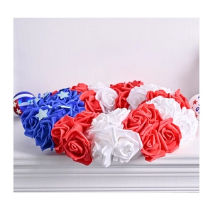 Detail of red white and blue foam rose wreath with stars for USA Independence Day decor