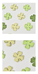 Detail of wooden shamrock cutouts for St. Patrick's Day with multi-tone green finishes