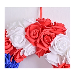 Close-up of red white and blue artificial rose wreath for USA Independence Day decor