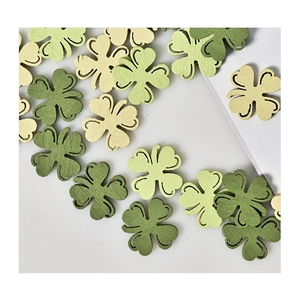 Close-up of wooden shamrock ornaments in shades of green for St. Patrick's Day decor