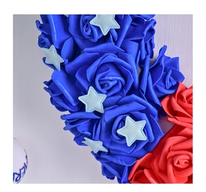 Close-up of red and blue foam roses with star accents for USA Independence Day decor