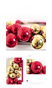 Detail of glossy red and gold Christmas baubles on festive wreath for holiday decor