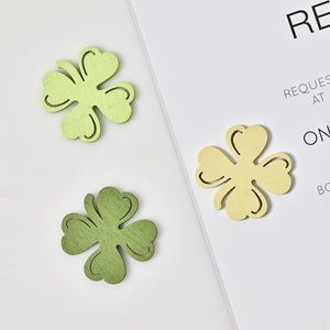 Three-color hollow wooden shamrock decorations in green and beige for lucky party decor