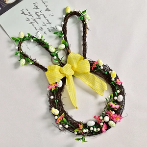 Easter rabbit-shaped rattan wreath with colorful eggs and a yellow plaid bow for garden decor