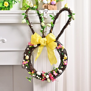 Easter bunny wreath made of woven twigs with colorful eggs and a yellow plaid bow