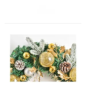 Detail of pine needles with gold and silver ornaments on a Nordic Christmas wreath