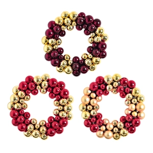Colorful electroplated Christmas bauble wreath in gold and red for festive home wall decor