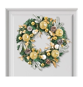 Close-up of Nordic Christmas wreath with pine needles, cones and gold ornaments