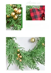 Close-up of a Christmas wreath featuring green pine branches, gold bells, and checkered bow
