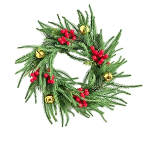 Classic Christmas wreath with green pine needles, red berries and gold bells on white background
