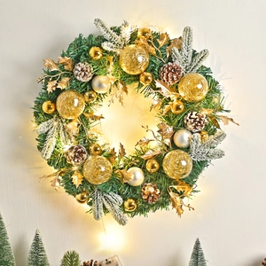 Nordic Christmas wreath with pine cones, golden bells, and warm LED fairy lights