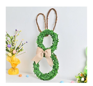 Close-up of green bunny wreath with burlap bow and twig ears for Easter home decor