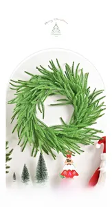 Detailed view of artificial Norfolk pine needles on a festive green Christmas wreath