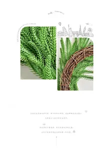Detail of green Norfolk pine needles and natural brown rattan base for Christmas wreath