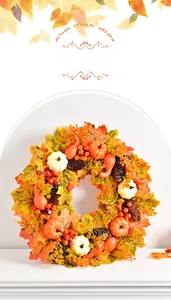 Detail of autumn wreath with maple leaves, mini pumpkins, pine cones and red berries