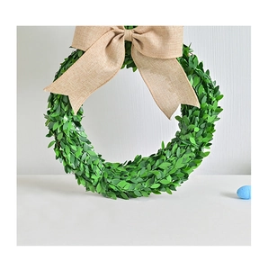 Detail of green leaf Easter bunny wreath with a natural jute burlap bow decoration