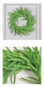 Close-up of realistic green Norfolk pine needles on a decorative Christmas wreath