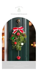 Close-up of Nordic Christmas door hanger with red bow pine cones and a large metal bell