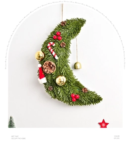 Detailed moon-shaped Christmas wreath with pine needles, cones, berries, and a golden bell
