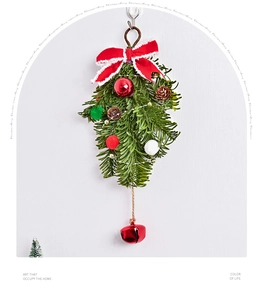 Close-up of Nordic Christmas ornament with red bow, pine cones, and a large metal bell