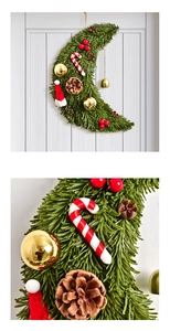 Detail of moon-shaped Christmas wreath with pine needles, candy canes and mini knit hat