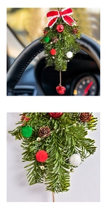 Detail of Christmas ornament with pine cones, red velvet bow and a small metal bell