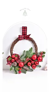 Detailed view of Christmas wreath with pine cones, red berries and plaid bows decoration