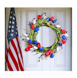 Detail of red white and blue tulip wreath on front door for Independence Day decor