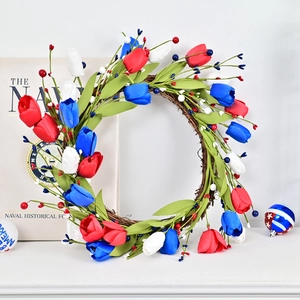 Patriotic red white and blue tulip wreath with mixed berries on a natural rattan base