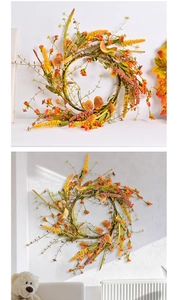 Detailed view of autumn wreath with lavender, maple leaves and berries on vine base