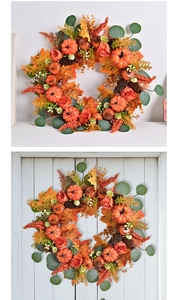 Detailed view of autumn wreath with pumpkins, pine cones, and maple leaves on white wood door