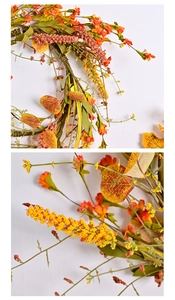 Detailed macro view of artificial autumn wreath with orange flowers and fall leaves