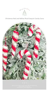 Macro view of plush red and white candy cane ornament with gold sequins on Christmas tree