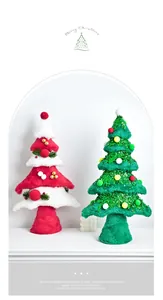 Detail view of plush mini Christmas trees with sequins and pom-poms for table decor