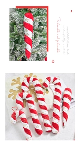 Close-up of red and white plush Christmas candy canes with gold snowflake patterns