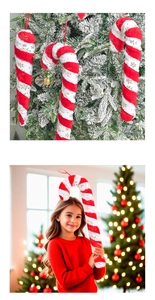 Detail of plush red and white candy cane ornaments with gold snowflakes on a Christmas tree