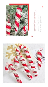 Close-up of red and white plush candy cane ornaments with golden sequin snowflake details