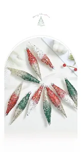 Macro view of teardrop Christmas ornaments with glitter patterns arranged in a circle