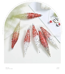 Detail of glittered teardrop Christmas ornaments with red and green sequins finish