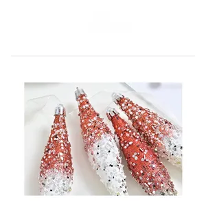 Detail of red and white Christmas icicle ornaments with glitter, sequins, and beads
