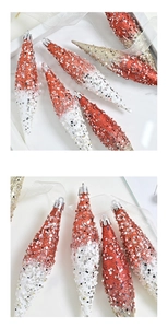 Macro detail of red and white glitter drop ornaments with sequins and beadwork