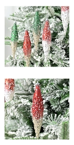 Macro detail of glitter icicle Christmas tree ornaments with sequins and hanging strings