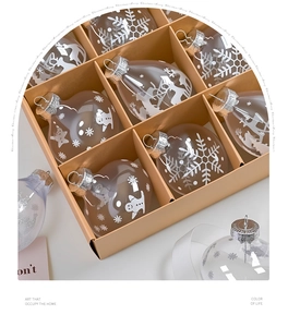 Macro detail of clear PET Christmas ornaments with snowflake patterns in a kraft paper box