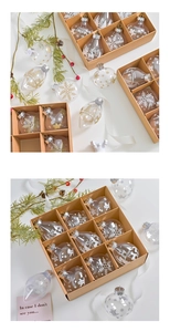 Detail of transparent PET Christmas ornaments in craft box with reindeer and snowflake prints